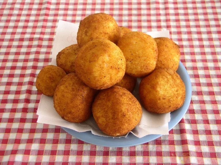 Аранчіні це золоті рисові кульки сицилійської кухні