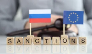 Санкції ЄС проти Росії за кібератаки: кубики SANCTIONS та прапори